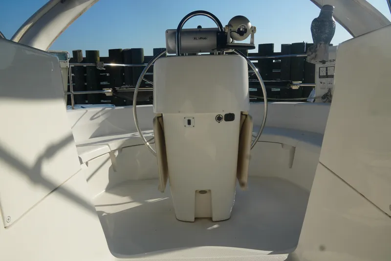 Andiamo Yacht Photos Pics 1998 Hunter 410 yacht cockpit with steering wheel and navigation equipment.