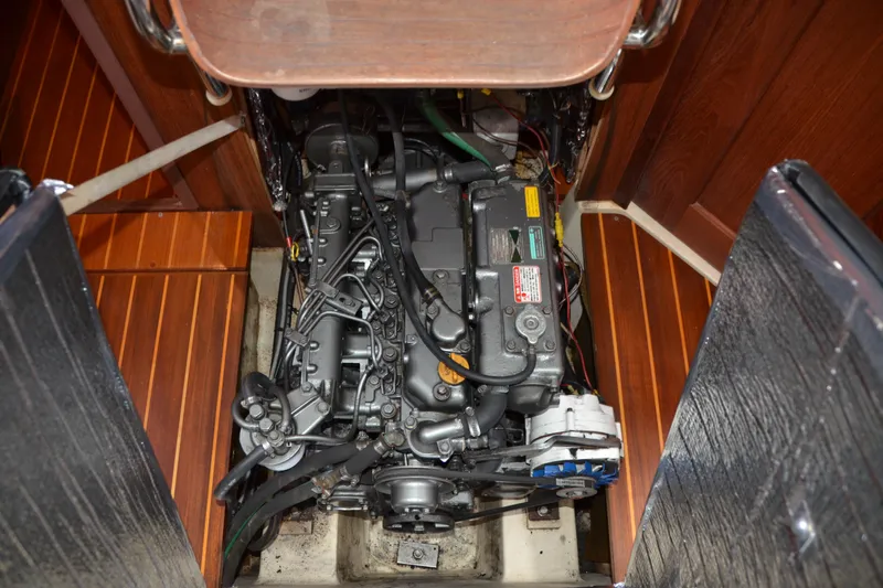 Andiamo Yacht Photos Pics Engine compartment of a 1998 Hunter 410 sailboat, showcasing detailed mechanical components.