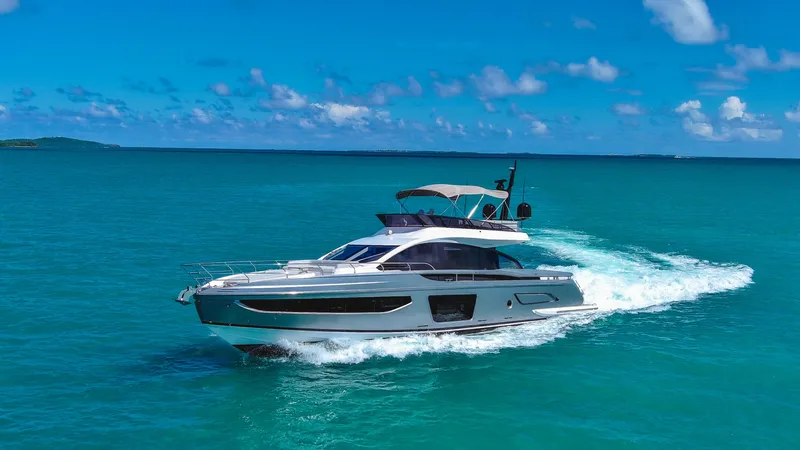 Salina Yacht Photos Pics 2024 Azimut S7 yacht cruising on turquoise ocean under clear blue sky.