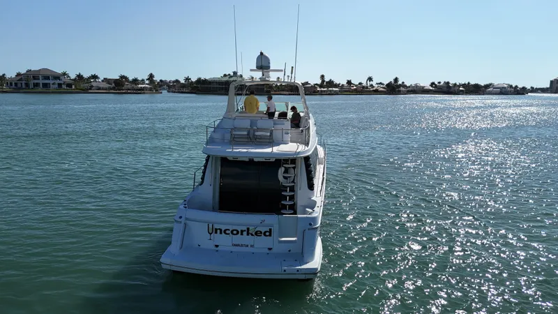 Bootlegger Yacht Photos Pics 1999 Carver 530 Voyager Pilothouse yacht cruising on a sunny day.