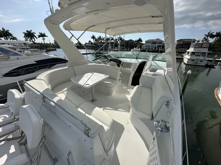 Bootlegger Yacht Photos Pics 1999 Carver 530 Voyager Pilothouse yacht with spacious deck and seating area in marina.