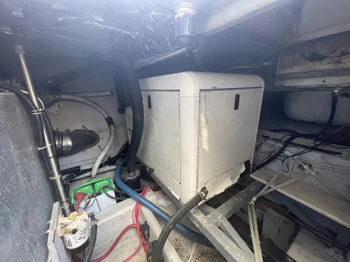 Bootlegger Yacht Photos Pics Engine room of 1999 Carver 530 Voyager Pilothouse with visible machinery and wiring.