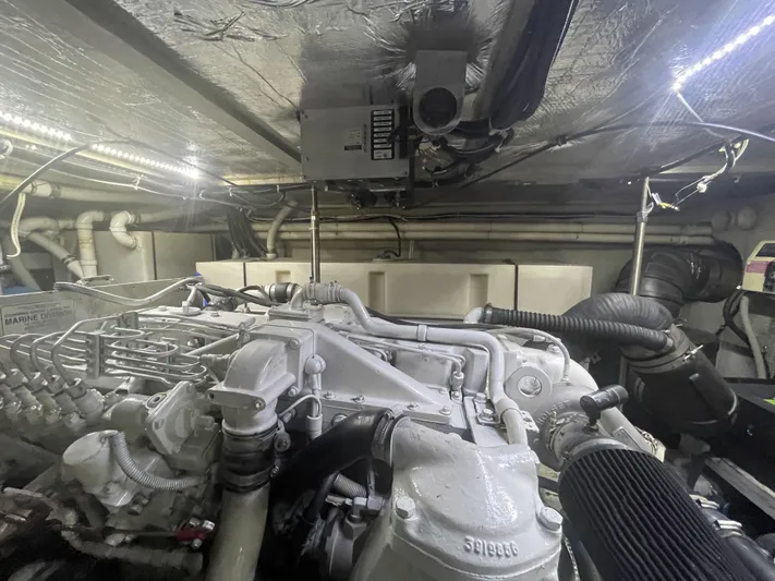 Bootlegger Yacht Photos Pics Engine room of 1999 Carver 530 Voyager Pilothouse with visible machinery and components.