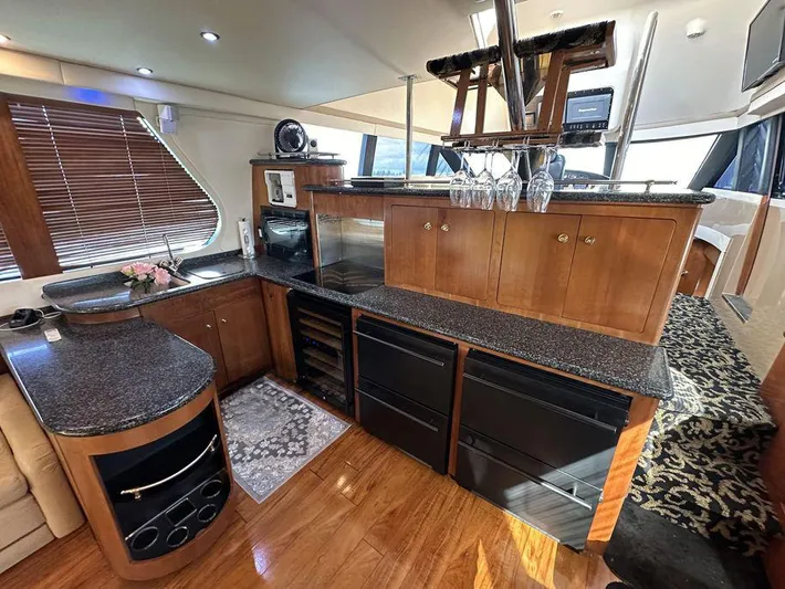 Bootlegger Yacht Photos Pics Luxurious interior of a 1999 Carver 530 Voyager Pilothouse yacht with modern kitchen amenities.