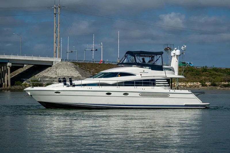 You Go Girl! Yacht Photos Pics Fairline Squadron 52 yacht from 2000 cruising on a calm waterway.