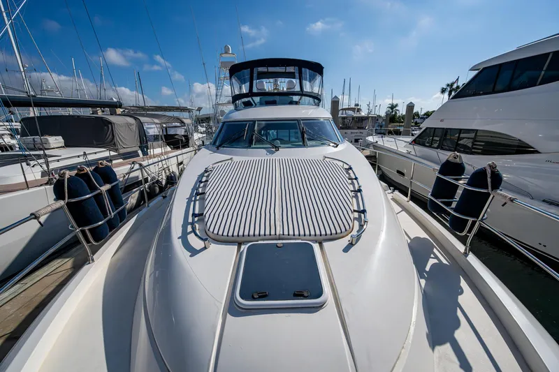 You Go Girl! Yacht Photos Pics Fairline Squadron 52 yacht, 2000 model, docked at marina under clear blue sky.
