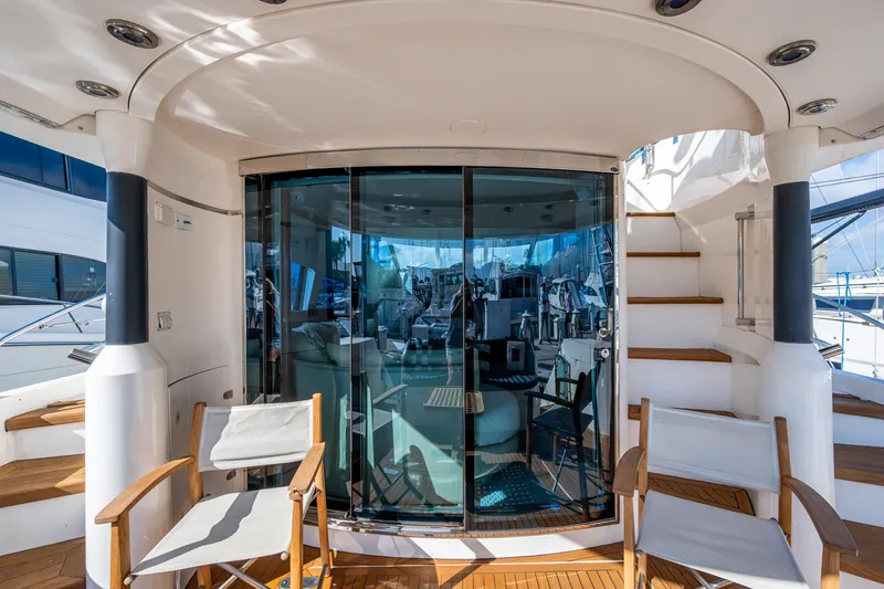 You Go Girl! Yacht Photos Pics Luxury yacht Fairline Squadron 52, 2000 model, featuring elegant deck seating and glass doors.