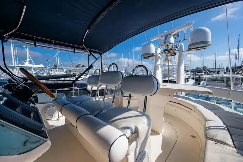 You Go Girl! Yacht Photos Pics Flybridge of 2000 Fairline Squadron 52 yacht with helm and seating, docked at marina.