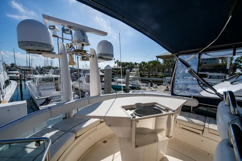 You Go Girl! Yacht Photos Pics 2000 Fairline Squadron 52 yacht deck with navigation equipment and seating area.