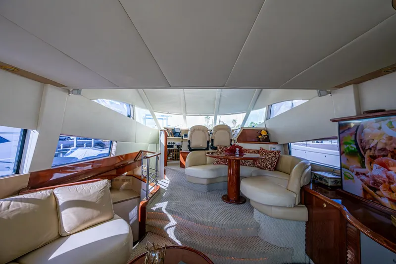 You Go Girl! Yacht Photos Pics Luxurious interior of 2000 Fairline Squadron 52 yacht with elegant seating and helm station.