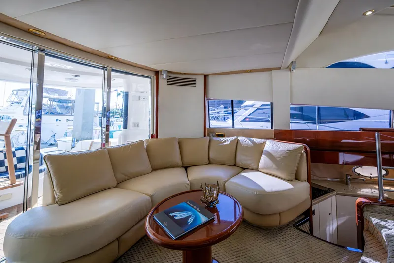 You Go Girl! Yacht Photos Pics Luxurious interior of 2000 Fairline Squadron 52 yacht with plush seating and elegant decor.