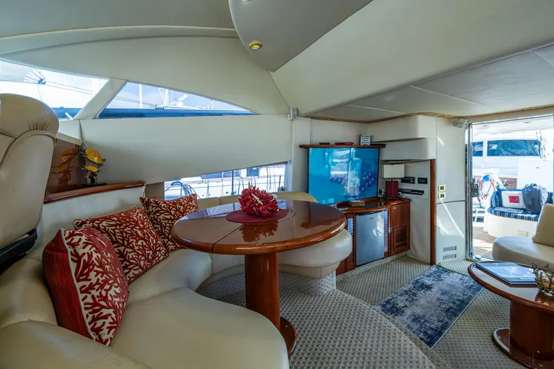 You Go Girl! Yacht Photos Pics Luxurious interior of 2000 Fairline Squadron 52 yacht with elegant seating and entertainment area.