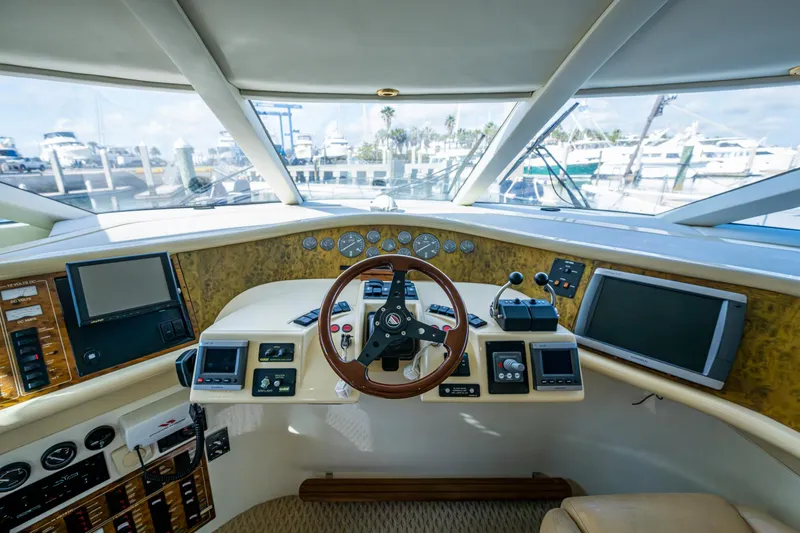 You Go Girl! Yacht Photos Pics Helm of 2000 Fairline Squadron 52 yacht with navigation instruments and steering wheel.