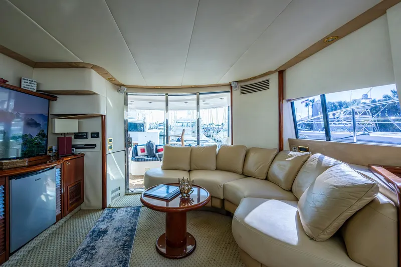 You Go Girl! Yacht Photos Pics Luxurious interior of 2000 Fairline Squadron 52 yacht with plush seating and elegant decor.