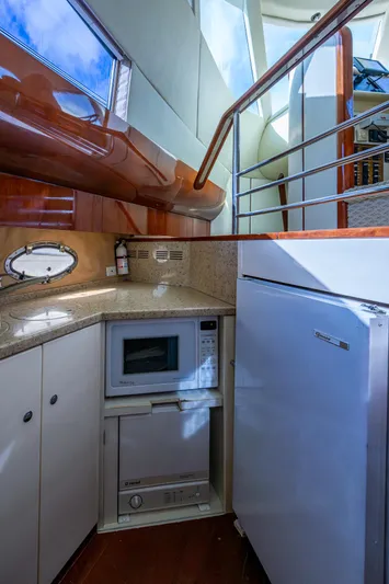 You Go Girl! Yacht Photos Pics Fairline Squadron 52 yacht kitchen interior with microwave and fridge, 2000 model.