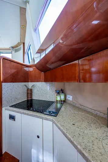You Go Girl! Yacht Photos Pics Interior kitchen of 2000 Fairline Squadron 52 yacht with modern amenities.
