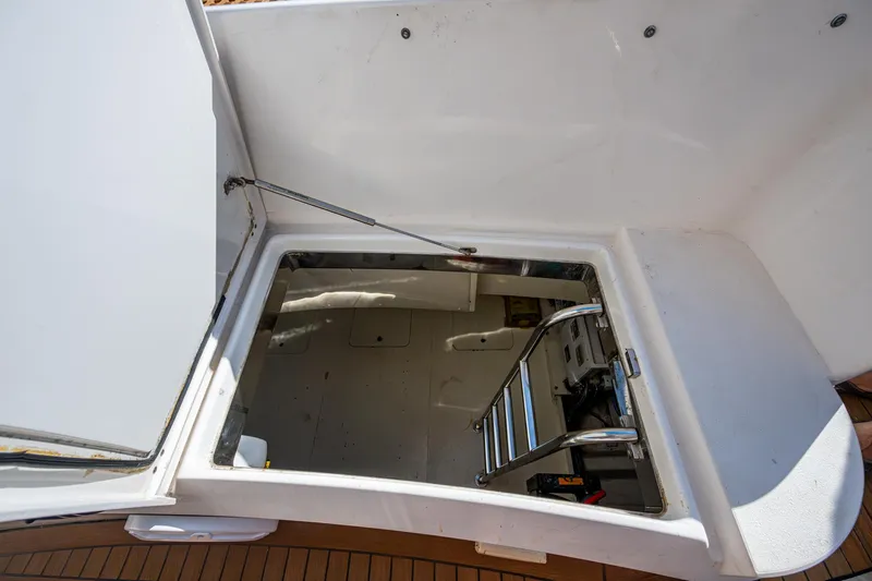 You Go Girl! Yacht Photos Pics Open hatch with ladder on 2000 Fairline Squadron 52 yacht deck.