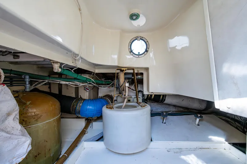 You Go Girl! Yacht Photos Pics Engine room of 2000 Fairline Squadron 52 yacht, showing mechanical components and piping.