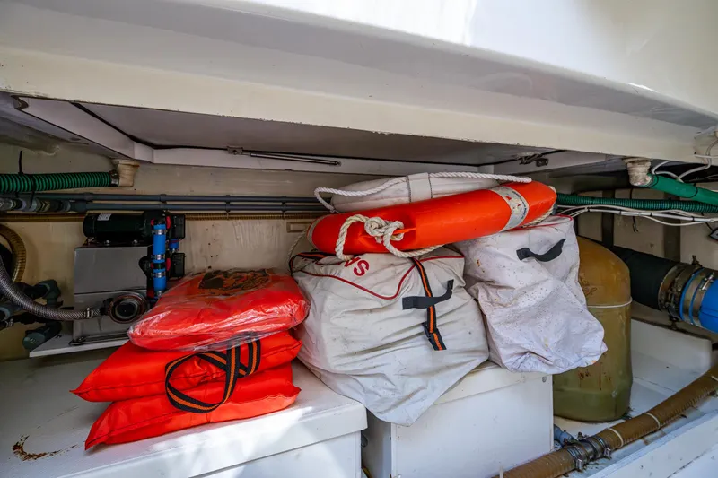 You Go Girl! Yacht Photos Pics Storage area on a 2000 Fairline Squadron 52 yacht with life jackets and safety equipment.