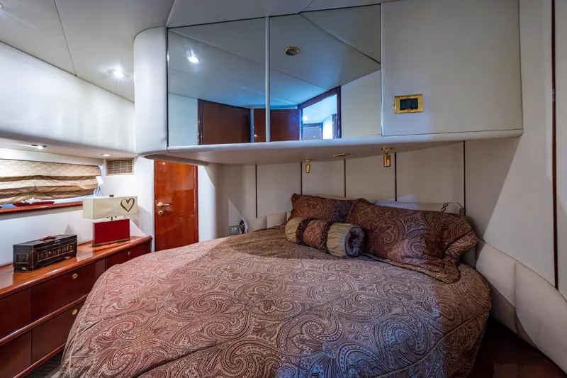 You Go Girl! Yacht Photos Pics Luxurious bedroom interior of 2000 Fairline Squadron 52 yacht with elegant bedding.