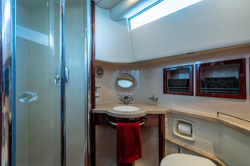 You Go Girl! Yacht Photos Pics Luxurious bathroom in 2000 Fairline Squadron 52 yacht with modern fixtures and elegant design.