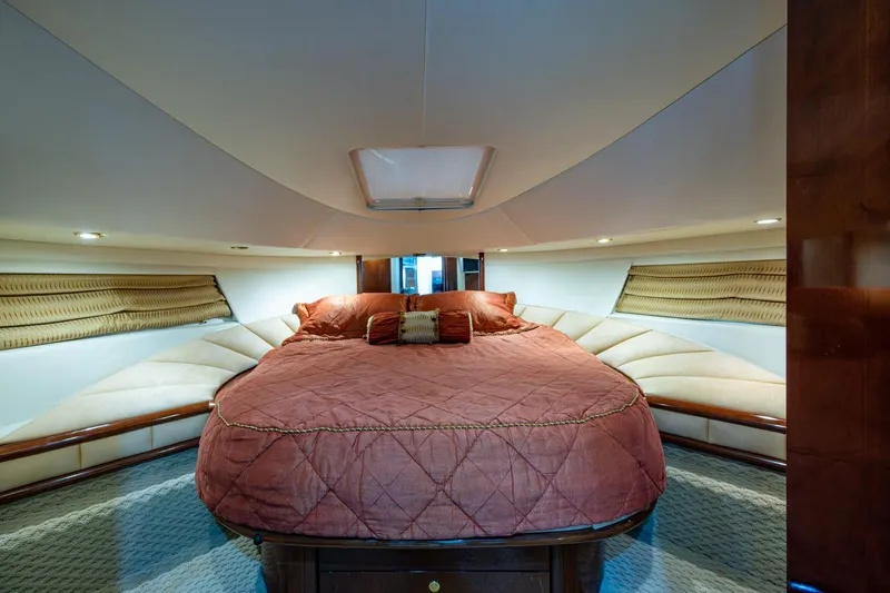 You Go Girl! Yacht Photos Pics Luxurious bedroom interior of 2000 Fairline Squadron 52 yacht with elegant bedding.