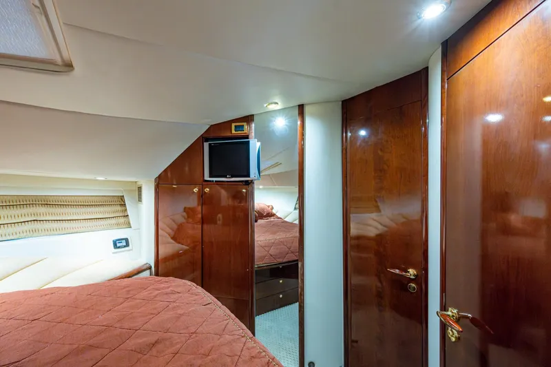 You Go Girl! Yacht Photos Pics Luxurious cabin interior of 2000 Fairline Squadron 52 yacht with wood paneling.