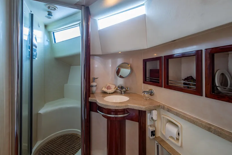 You Go Girl! Yacht Photos Pics Bathroom interior of 2000 Fairline Squadron 52 yacht, featuring shower and sink.