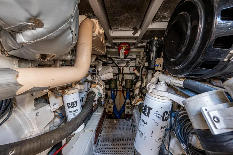 You Go Girl! Yacht Photos Pics Engine room of 2000 Fairline Squadron 52 yacht, featuring CAT machinery and complex piping.