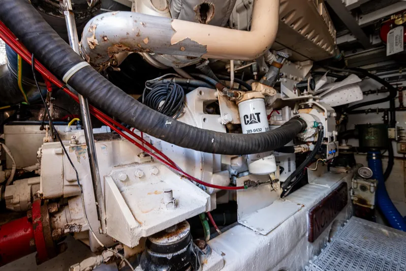 You Go Girl! Yacht Photos Pics Engine room of 2000 Fairline Squadron 52 yacht, featuring CAT machinery and complex piping.