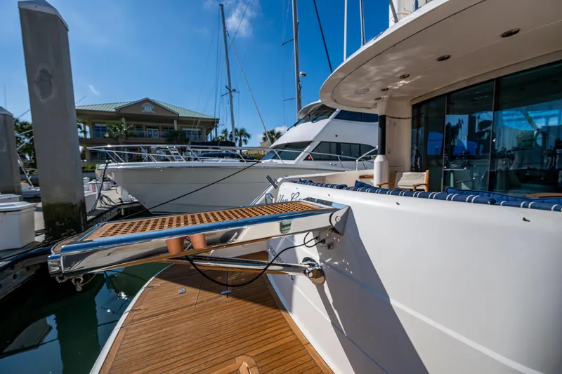 You Go Girl! Yacht Photos Pics 2000 Fairline Squadron 52 yacht docked at marina, featuring teak deck and modern design.