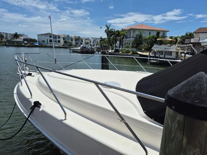 Freebyrd II Yacht Photos Pics 2002 Silverton 38 Convertible yacht docked in a scenic marina setting.