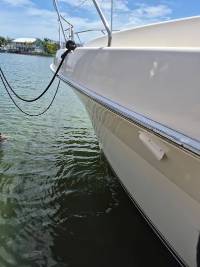 Freebyrd II Yacht Photos Pics 2002 Silverton 38 Convertible yacht docked on calm water under a clear sky.