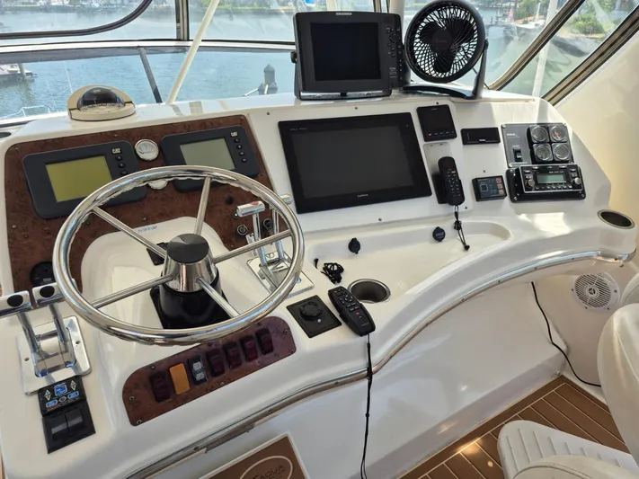 Freebyrd II Yacht Photos Pics Control panel of a 2002 Silverton 38 Convertible yacht with navigation equipment.