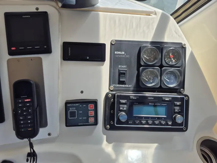 Freebyrd II Yacht Photos Pics Control panel of a 2002 Silverton 38 Convertible boat with gauges and electronics.