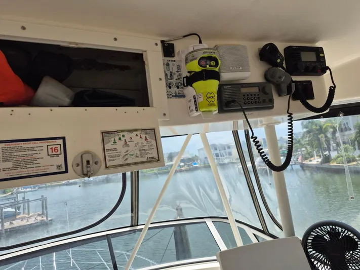 Freebyrd II Yacht Photos Pics Interior view of a 2002 Silverton 38 Convertible boat with communication equipment.