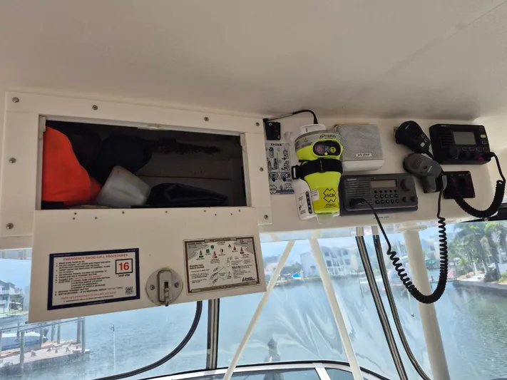 Freebyrd II Yacht Photos Pics Interior view of a 2002 Silverton 38 Convertible boat with communication equipment.