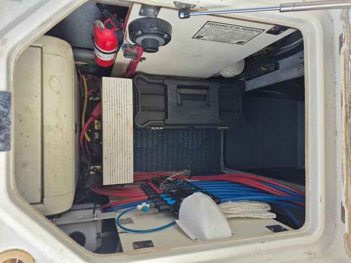 Freebyrd II Yacht Photos Pics Engine compartment of a 2002 Silverton 38 Convertible boat with wiring and fire extinguisher.