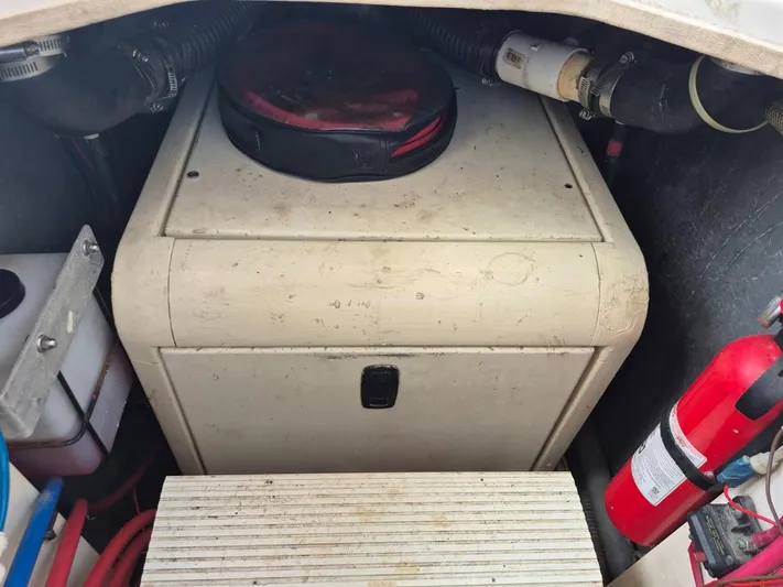 Freebyrd II Yacht Photos Pics Engine compartment of 2002 Silverton 38 Convertible with fire extinguisher and equipment.