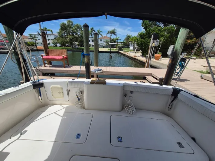 Freebyrd II Yacht Photos Pics 2002 Silverton 38 Convertible boat interior at dock, sunny day, waterfront view.