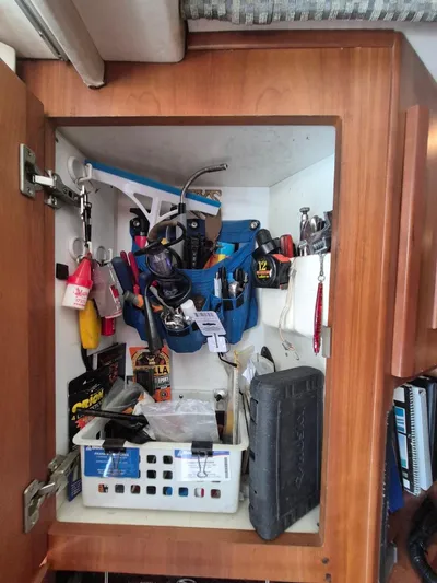 Freebyrd II Yacht Photos Pics Cabinet with tools and supplies on a 2002 Silverton 38 Convertible boat.