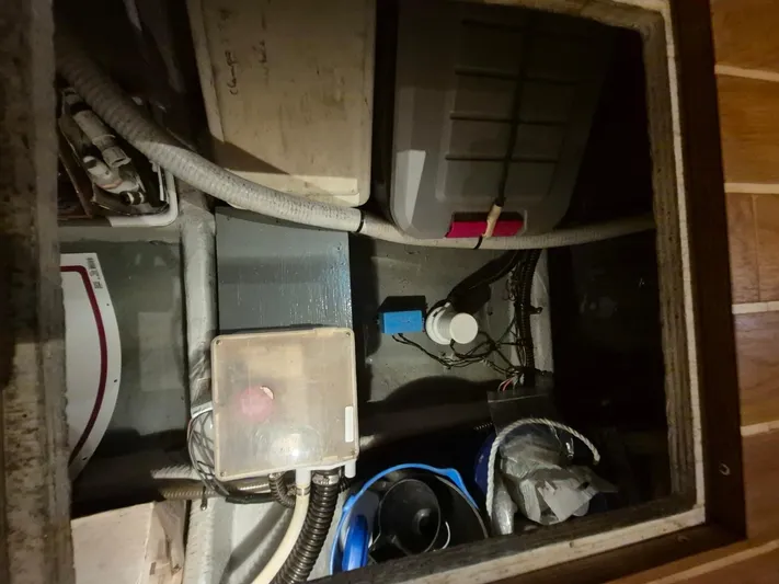 Freebyrd II Yacht Photos Pics Engine compartment of a 2002 Silverton 38 Convertible boat, showing various equipment and wiring.