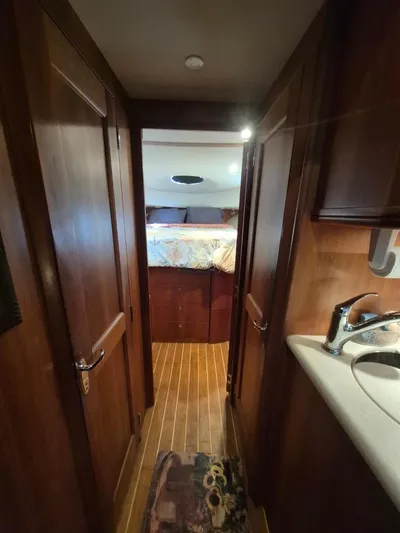 Freebyrd II Yacht Photos Pics Interior of 2002 Silverton 38 Convertible yacht, featuring a cozy cabin and wooden finishes.