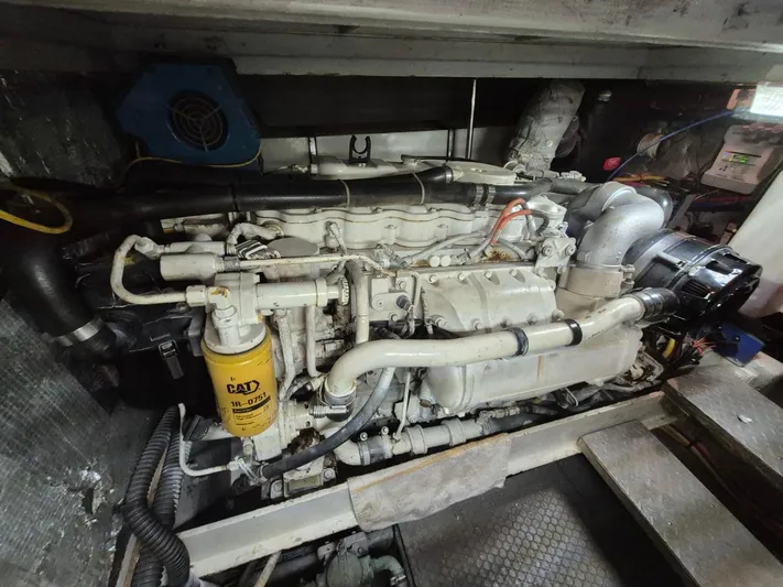 Freebyrd II Yacht Photos Pics Engine room of a 2002 Silverton 38 Convertible boat, featuring a CAT diesel engine.