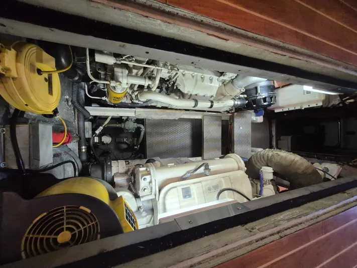 Freebyrd II Yacht Photos Pics Engine room of a 2002 Silverton 38 Convertible boat, showcasing mechanical components.