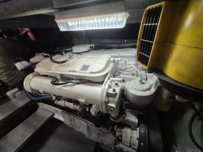 Freebyrd II Yacht Photos Pics Engine room of a 2002 Silverton 38 Convertible boat, featuring a well-maintained engine.