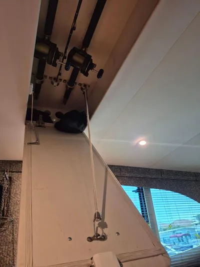 Freebyrd II Yacht Photos Pics Interior view of 2002 Silverton 38 Convertible with fishing rods stored overhead.