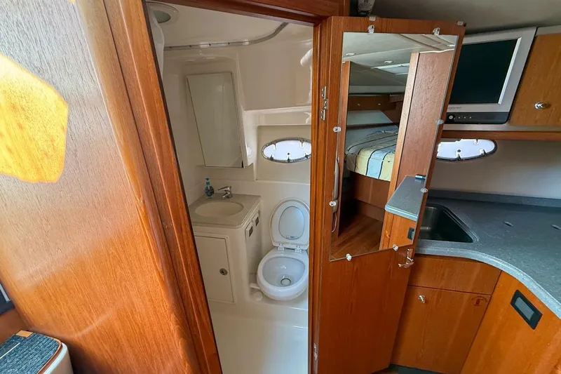  Yacht Photos Pics 2006 Tiara 3600 yacht interior with bathroom, mirror, and kitchenette.