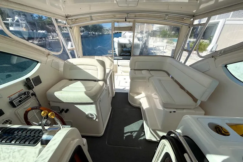  Yacht Photos Pics Interior of a 2006 Tiara 3600 yacht with white seating and helm.
