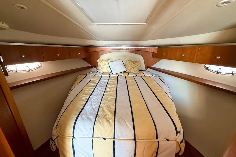  Yacht Photos Pics Luxurious cabin interior of a 2006 Tiara 3600 yacht with cozy bedding.